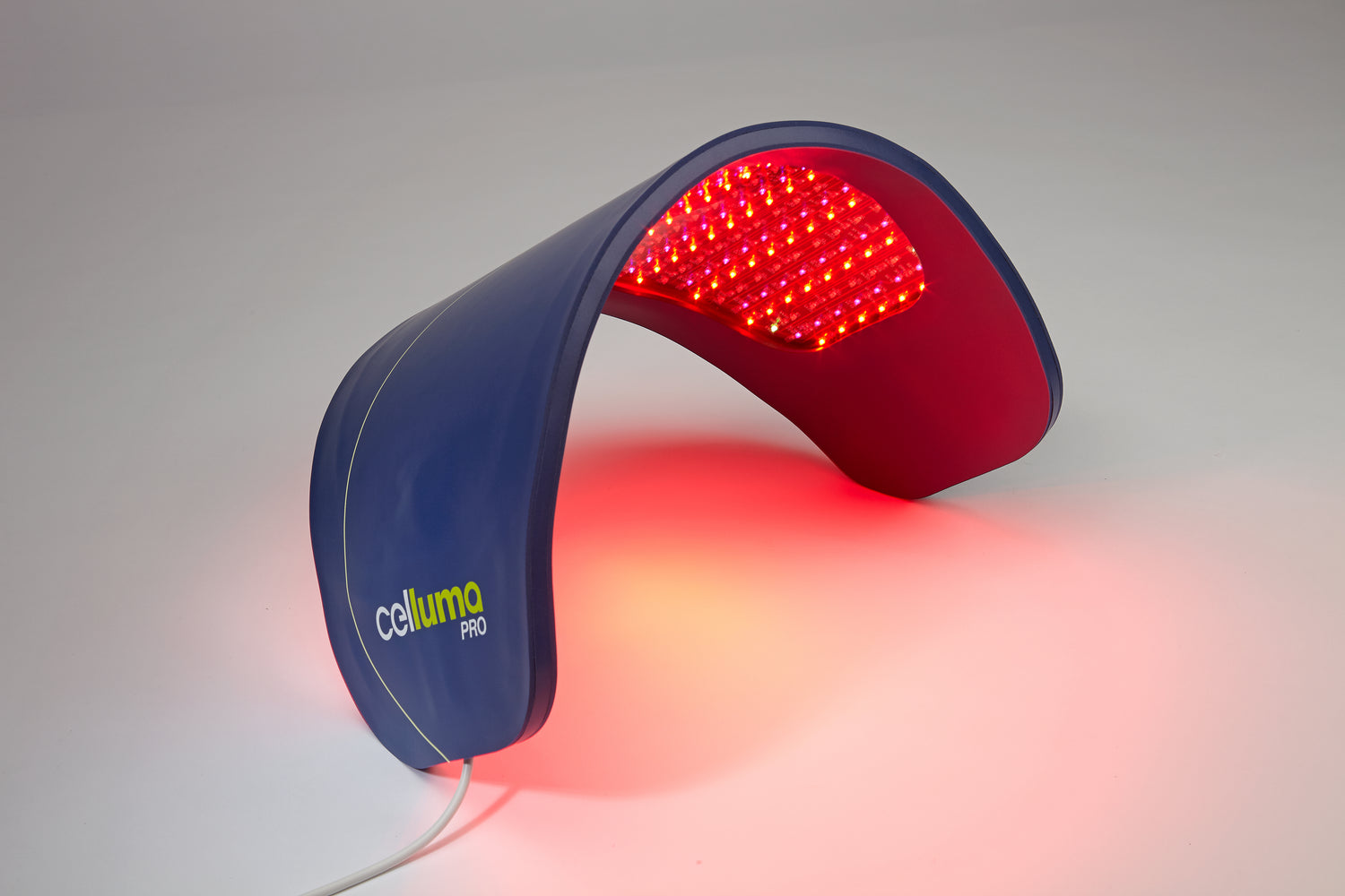 Red light therapy device with 'Caluma' branding on a gray background